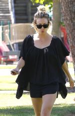 KALEY CUOCO Walks Her Dog Out at a Park in Los Angeles 09/27/2015