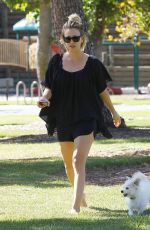 KALEY CUOCO Walks Her Dog Out at a Park in Los Angeles 09/27/2015