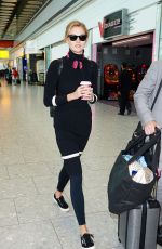 KARLIE KLOSS at Heathrow Airport in London 09/29/2015