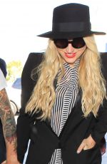 KESHA SEBERT Arrives at LAX Airport in Los Angeles 09/18/2015