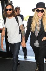 KESHA SEBERT Arrives at LAX Airport in Los Angeles 09/18/2015