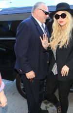 KESHA SEBERT Arrives at LAX Airport in Los Angeles 09/18/2015