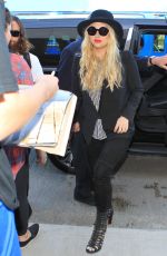 KESHA SEBERT Arrives at LAX Airport in Los Angeles 09/18/2015