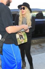 KESHA SEBERT Arrives at LAX Airport in Los Angeles 09/18/2015