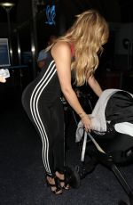 KHLOE KARDASHIAN in Tights at LAX Airport in Los Angeles 09/16/2015
