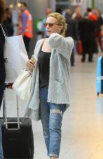 KYLIE MINOGUE Arrives at Heathrow Aiport in London 08/29/2015