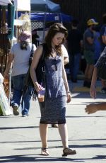 LILY COLLINS Shopping at Flea Market in Los Angeles 09/13/2015