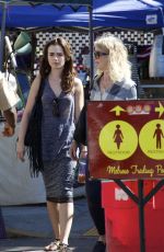 LILY COLLINS Shopping at Flea Market in Los Angeles 09/13/2015
