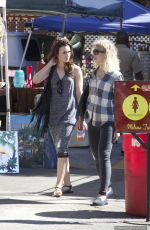 LILY COLLINS Shopping at Flea Market in Los Angeles 09/13/2015