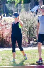 REESE WITHERSPOON in Tights Out Jogging in Santa Monica 09/20/2015