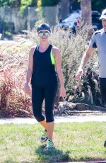 REESE WITHERSPOON in Tights Out Jogging in Santa Monica 09/20/2015