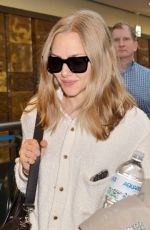 AMANDA SEYFRIED at Narita International Airport in Tokyo 10/08/2015