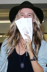BEHATI PRINSLOO on Ripped Jeans Arrives at LAX Airport in Los Angeles 10/11/2015