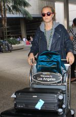 CARA DELEVINGNE Arrives at LAX Airport in Los Angeles 10/14/2015