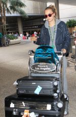 CARA DELEVINGNE Arrives at LAX Airport in Los Angeles 10/14/2015
