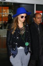 CARA DELEVINGNE at Charles De Gaulle Airport in Paris 10/19/2015