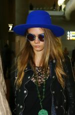 CARA DELEVINGNE at Charles De Gaulle Airport in Paris 10/19/2015