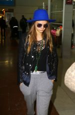 CARA DELEVINGNE at Charles De Gaulle Airport in Paris 10/19/2015