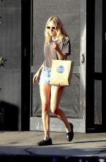 CHLOE SEVIGNY in Denim Shorts Riding a Bike Out in Venice 10/28/2015