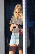 CHLOE SEVIGNY in Denim Shorts Riding a Bike Out in Venice 10/28/2015