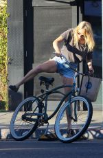 CHLOE SEVIGNY in Denim Shorts Riding a Bike Out in Venice 10/28/2015