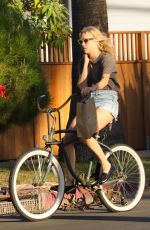 CHLOE SEVIGNY in Denim Shorts Riding a Bike Out in Venice 10/28/2015