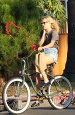CHLOE SEVIGNY in Denim Shorts Riding a Bike Out in Venice 10/28/2015