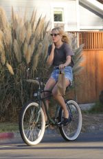 CHLOE SEVIGNY in Denim Shorts Riding a Bike Out in Venice 10/28/2015