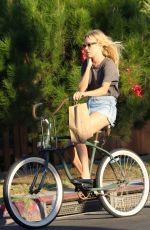 CHLOE SEVIGNY in Denim Shorts Riding a Bike Out in Venice 10/28/2015