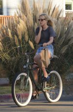 CHLOE SEVIGNY in Denim Shorts Riding a Bike Out in Venice 10/28/2015