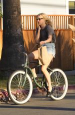 CHLOE SEVIGNY in Denim Shorts Riding a Bike Out in Venice 10/28/2015