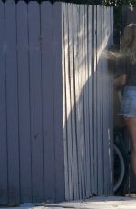 CHLOE SEVIGNY in Denim Shorts Riding a Bike Out in Venice 10/28/2015