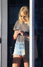 CHLOE SEVIGNY in Denim Shorts Riding a Bike Out in Venice 10/28/2015