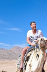 DANIELLA WESTBROOK in Bikini Riding a Camel in Egypt