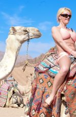 DANIELLA WESTBROOK in Bikini Riding a Camel in Egypt