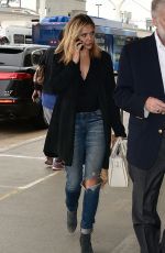 ELIZABETH OLSEN in Ripped Jeans at LAX Airport in Los Angeles 10/16/2015