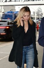 ELIZABETH OLSEN in Ripped Jeans at LAX Airport in Los Angeles 10/16/2015