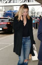 ELIZABETH OLSEN in Ripped Jeans at LAX Airport in Los Angeles 10/16/2015