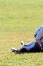 HILARY DUFF Playing with Dogs at a Park in New York 10/11/2015