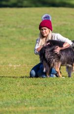 HILARY DUFF Playing with Dogs at a Park in New York 10/11/2015