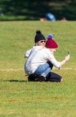 HILARY DUFF Playing with Dogs at a Park in New York 10/11/2015