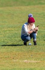 HILARY DUFF Playing with Dogs at a Park in New York 10/11/2015