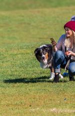 HILARY DUFF Playing with Dogs at a Park in New York 10/11/2015
