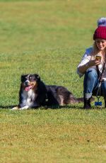 HILARY DUFF Playing with Dogs at a Park in New York 10/11/2015