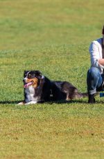 HILARY DUFF Playing with Dogs at a Park in New York 10/11/2015