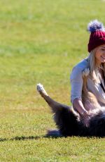 HILARY DUFF Playing with Dogs at a Park in New York 10/11/2015