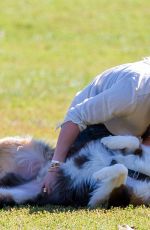 HILARY DUFF Playing with Dogs at a Park in New York 10/11/2015