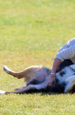 HILARY DUFF Playing with Dogs at a Park in New York 10/11/2015