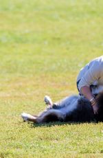 HILARY DUFF Playing with Dogs at a Park in New York 10/11/2015