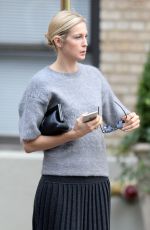 KELLY RUTHERFORD Hails a Cab in New York 10/14/2015